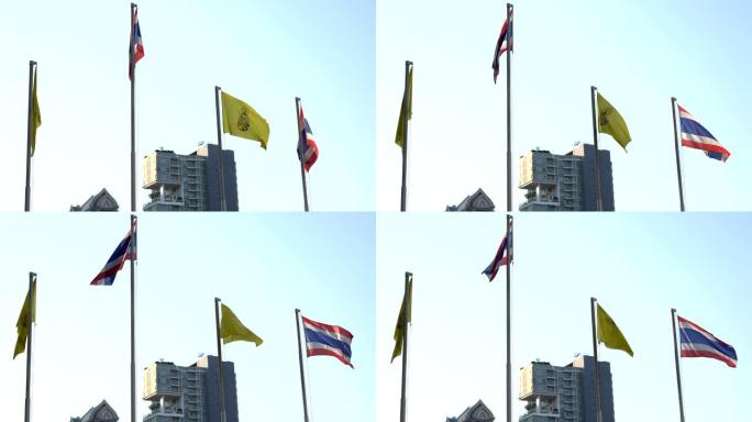dhammacakka旗帜，泰国佛教的象征和泰国王国的旗帜在曼谷的风中飘扬的4k实时视频