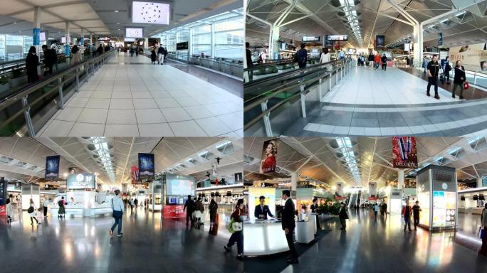 4K自动扶梯与拥挤的乘客一起进入香港国际机场候机楼