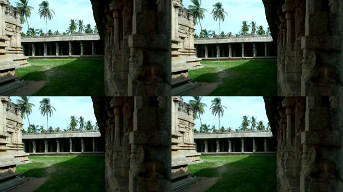 具有历史重要性的百年石庙，带有柱子和版画。