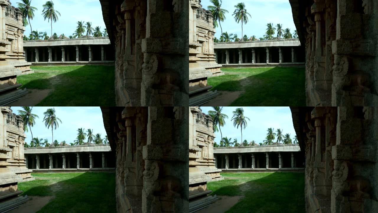 具有历史重要性的百年石庙，带有柱子和版画。