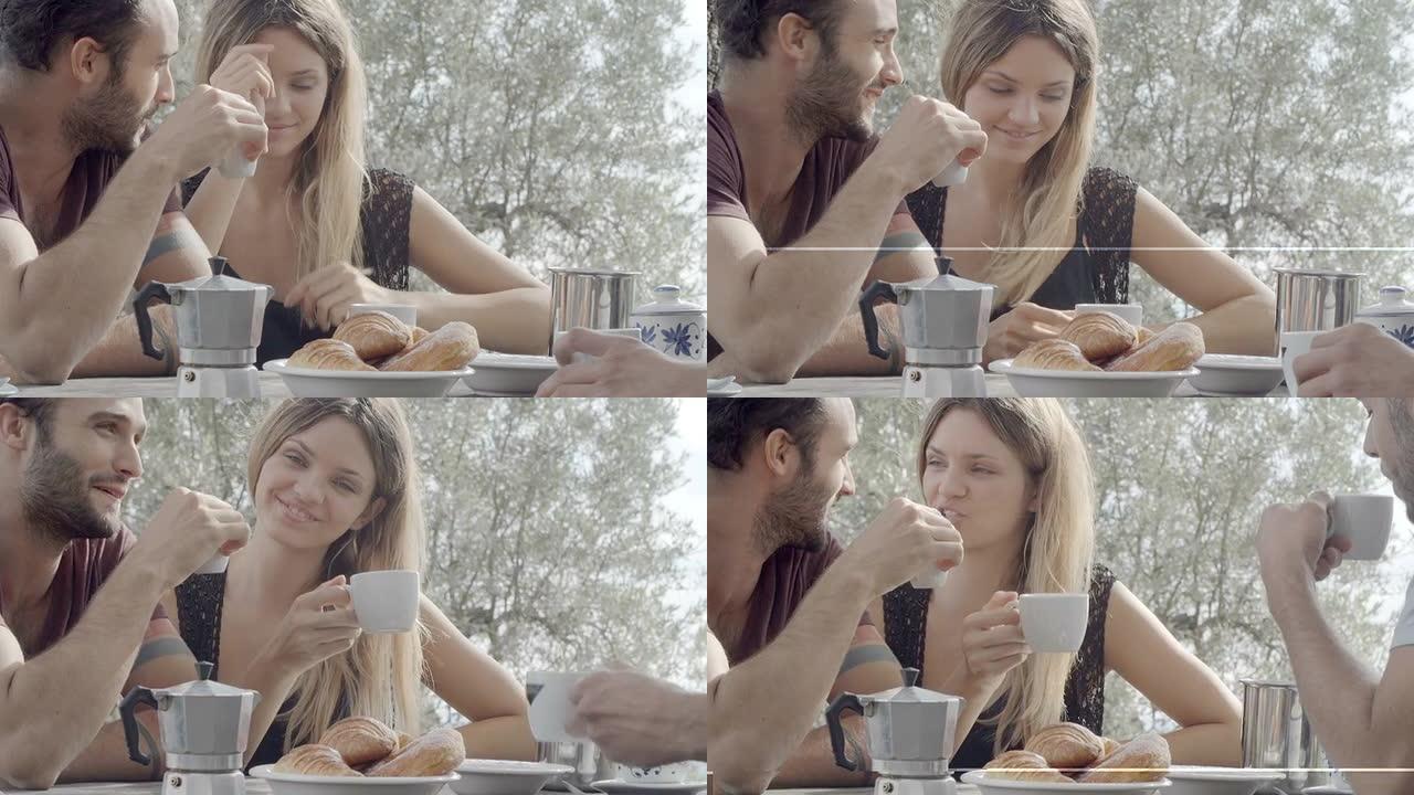几个快乐的男人和女人朋友在意大利早餐时微笑、大笑和喝咖啡，在托斯卡纳夏季阳光明媚的早晨，在自然乡村风