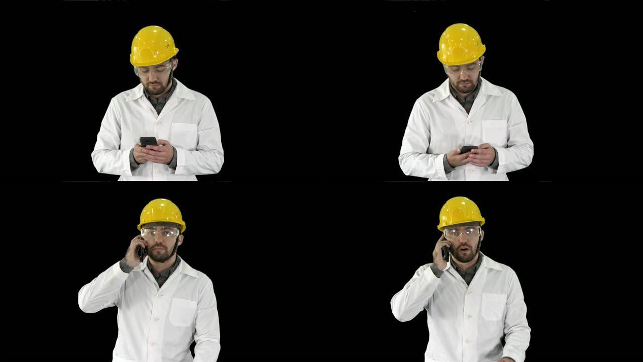 工程师戴着防护眼镜和帽子走路，拿起电话，阿尔法频道