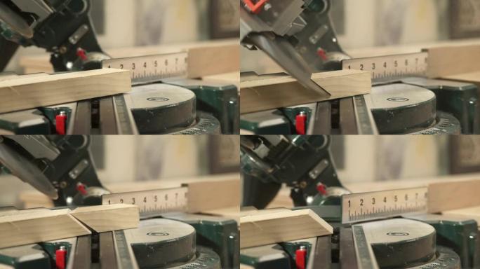斜切锯的前视图，在锯末飞行的情况下以选定的角度切割工件。一只手正在拿切割的工件