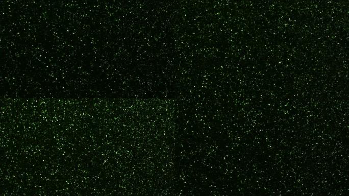 绿色颗粒背景。粒子不同运动的闪光系列。版本1