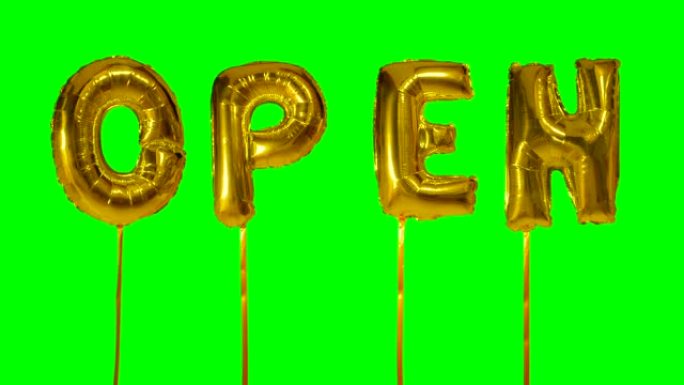 从绿色屏幕上漂浮的氦气金色气球字母打开单词