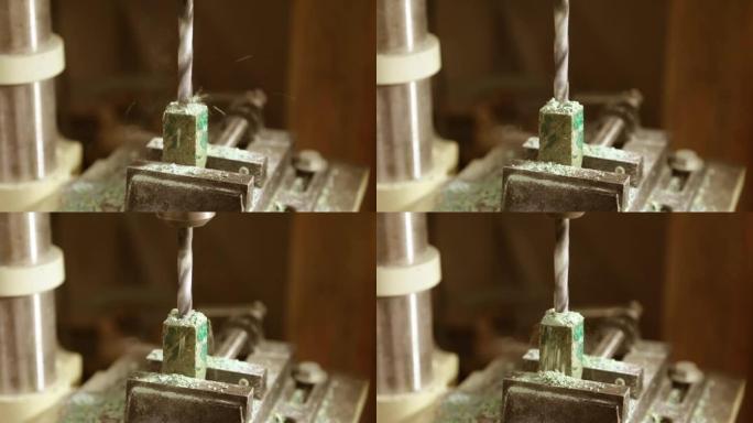 慢动作和刨花钻孔机。在木制工件上钻孔。