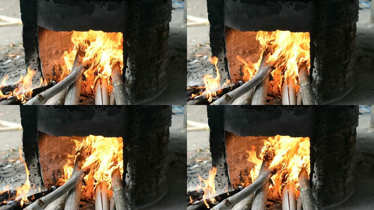在干燥的竹子上燃烧火焰以煮沸甘蔗汁
