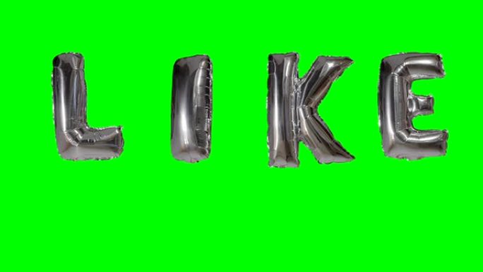 像漂浮在绿色屏幕上的氦气银气球字母一样的单词