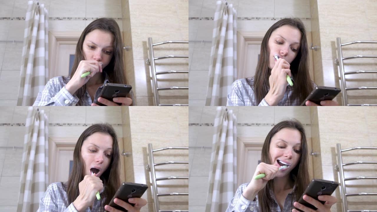女人在浴室刷牙，用手机看视频。
