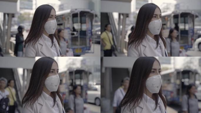 亚洲女人要上班了，戴N95口罩，防PM2.5粉尘雾霾，她在咳嗽