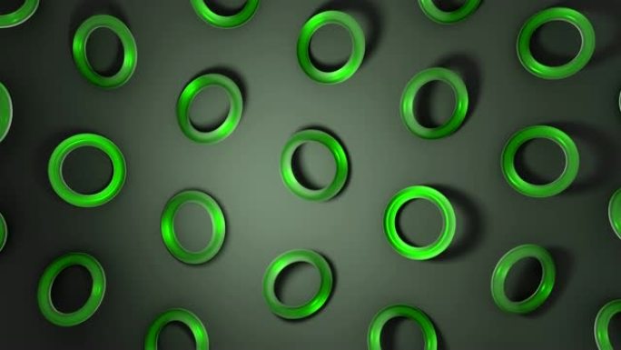 3D绿色玻璃圆环在黑暗表面旋转。抽象创意4k无缝循环动画。