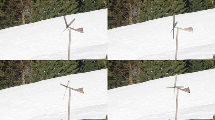 冬天在风中旋转的木制风车
