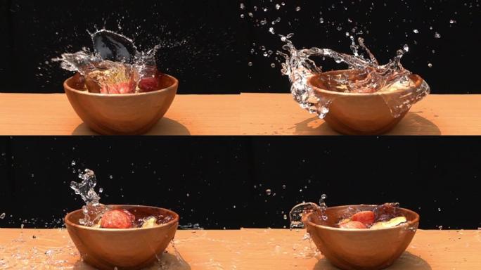 在木碗中掉入水中的红苹果片