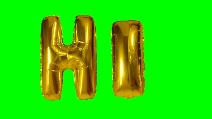 漂浮在绿色屏幕上的氦气金气球字母中的hi字