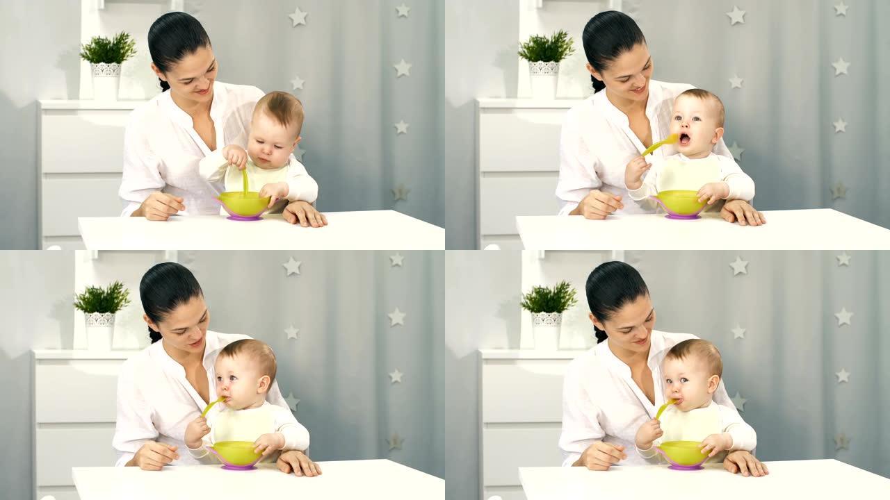 母亲帮助婴儿自己吃饭