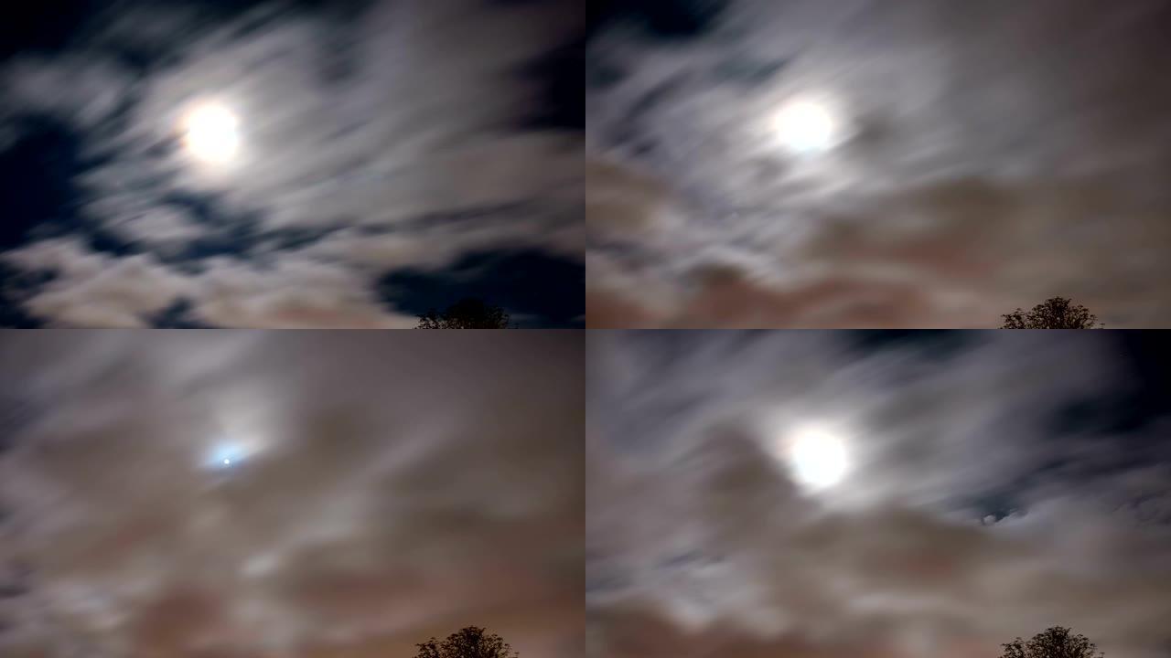 晚上满月在云层后面的时间流逝