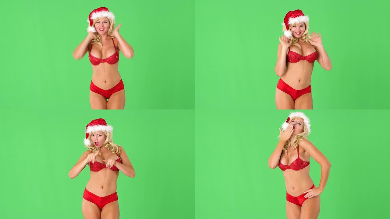 戴着圣诞老人帽子的性感女人，带着礼物和吹吻