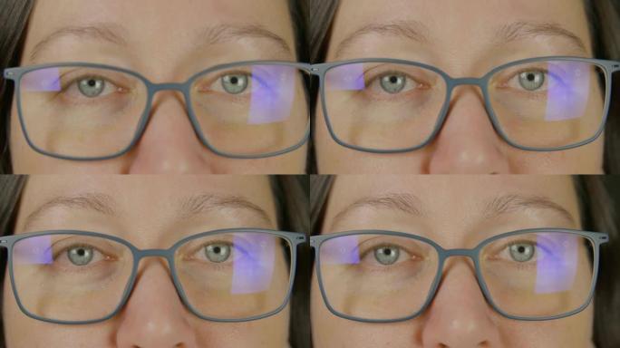 戴眼镜的肖像女人蓝眼睛闭上眼睛，眨眨眼，微距工作室拍摄特写
