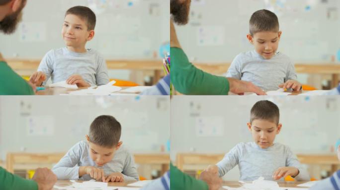 男孩听老师说，用剪刀剪纸