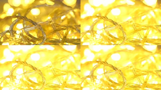 电动花环闪烁黄灯特写。