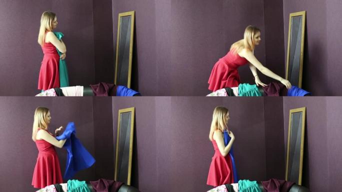 女人在镜子旁边试穿一件衣服。