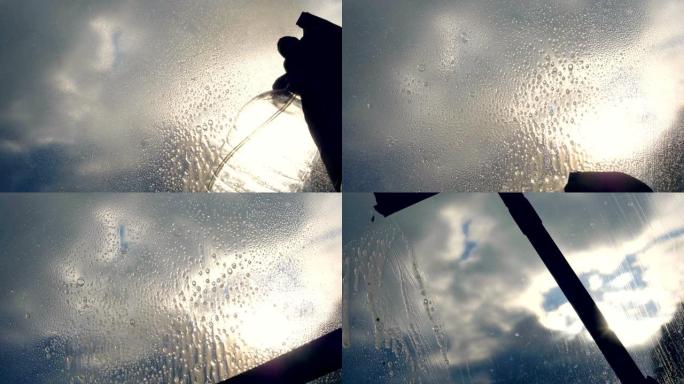 关闭手动管家喷雾器在窗户玻璃清洁剂和刷子清洗