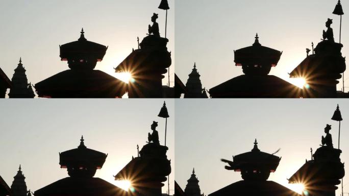 明亮的阳光下的杜巴广场。尼泊尔东方古城巴克塔普尔皇家杜巴广场上的东方建筑和寺庙剪影。