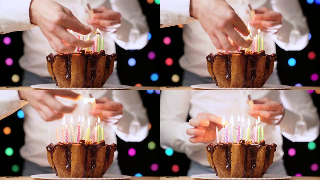男人用火柴点燃生日蜡烛。生日派对上的巧克力蛋糕，特写4k镜头