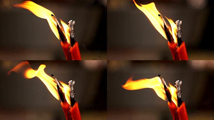 寺庙中燃烧的红色中国蜡烛产生的火焰慢动作