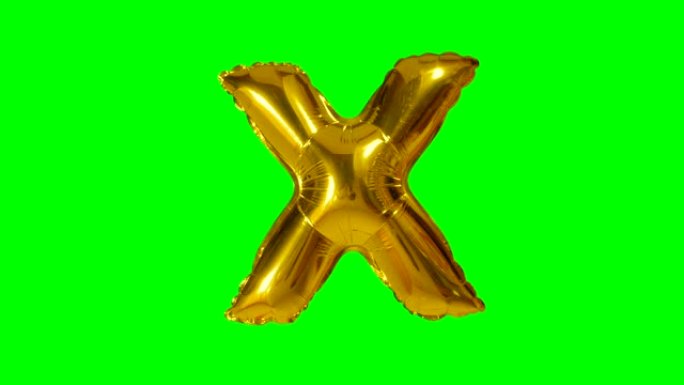 大字母X来自漂浮在绿色屏幕上的字母氦气黄金气球