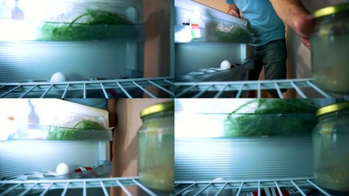 这个人打开冰箱，他半空，露出脸，把罐子放在冰箱里。