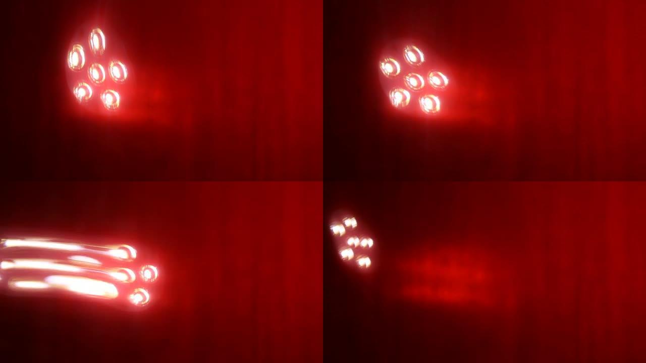 六个发光二极管灯在红色背景上移动