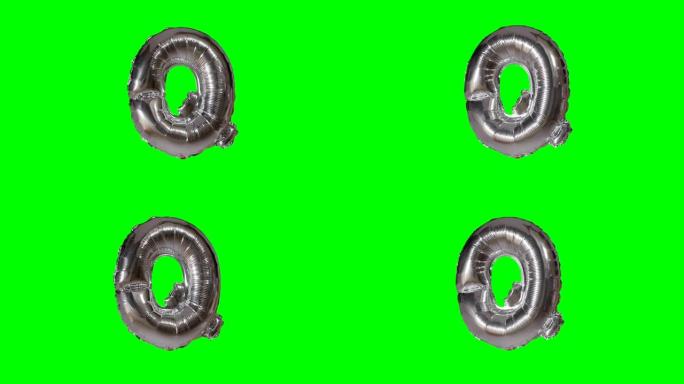 大字母Q来自漂浮在绿色屏幕上的字母氦气银气球