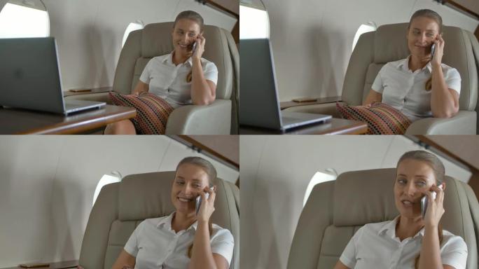 快乐的女商人谈论小型私人飞机内的豪华旅行