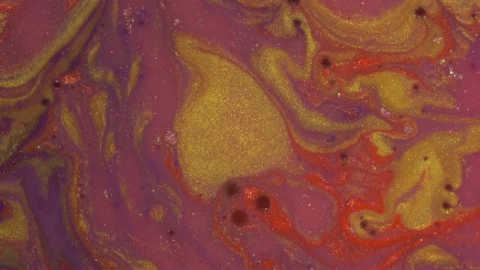 紫金黄珊瑚墨水。液体闪闪发光的油漆移动和混合