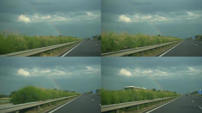 在高速公路上驾驶汽车驶向彩虹