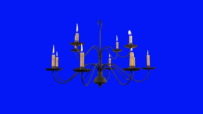 蓝屏背景上燃烧蜡烛的旧吊灯
