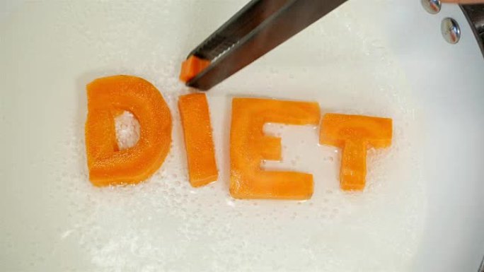 从胡萝卜雕刻的字母中收集的单词饮食