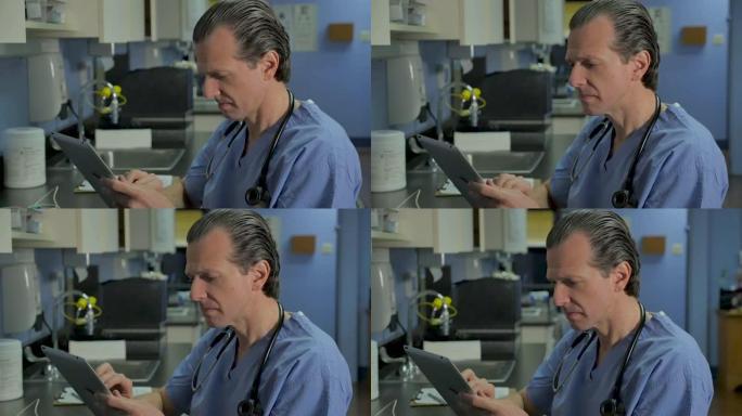 男护士或医生在数字平板电脑上查看病历