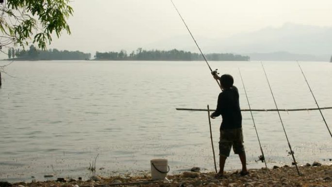 渔夫飞入湖中钓鱼