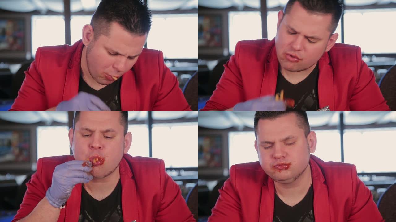 男人吃番茄酱炸薯条