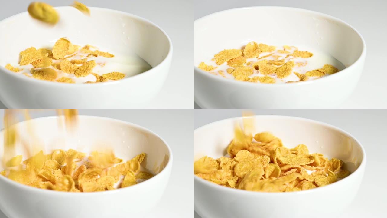 玉米片掉在装有牛奶的白色陶瓷碗中