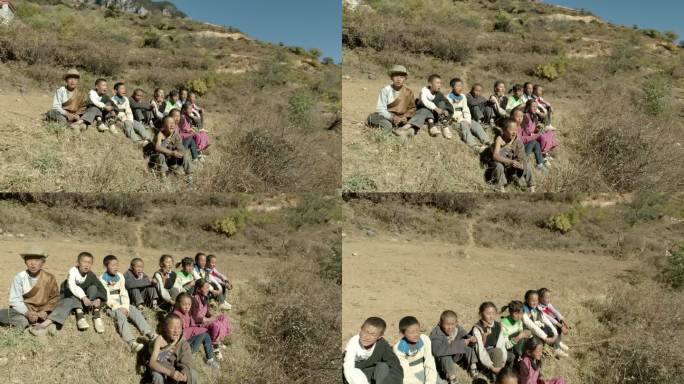 藏族儿童孩子在山坡唱歌