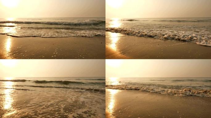 海滩上的中浪和早晨的日出之光
