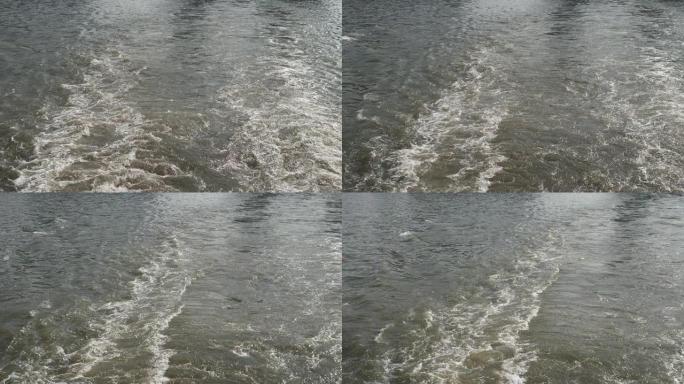 船在河上醒来，大船后面的水泡沫痕迹走了，高速摄像头，慢动作。