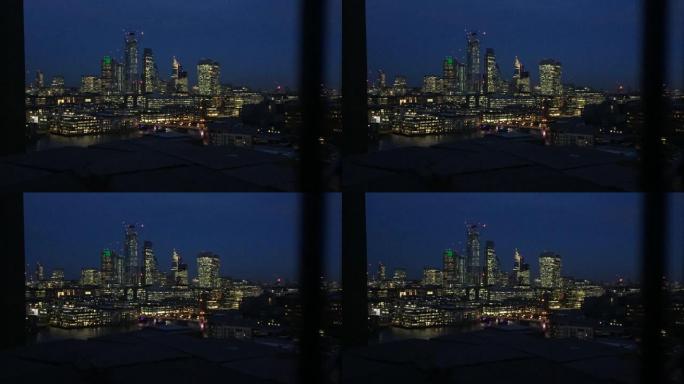 伦敦英国，城市天际线摩天大楼在晚上照亮泰晤士河的景色，包括商业金融区泰晤士河南岸的滑铁卢日落