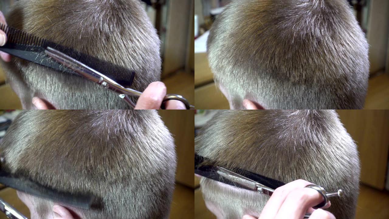 男人发型的特写发型的机器发型的理发师