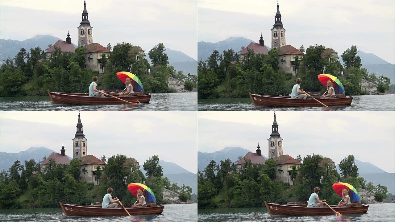 两个人在船上划船的宽镜头