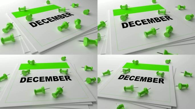 白色背景上的绿色12月日历，带绿色别针