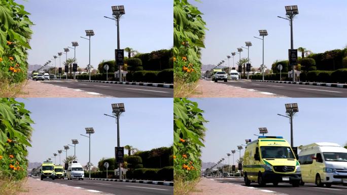 埃及公司的汽车和救护车沿着旅游小镇沙姆沙伊赫的道路行驶。